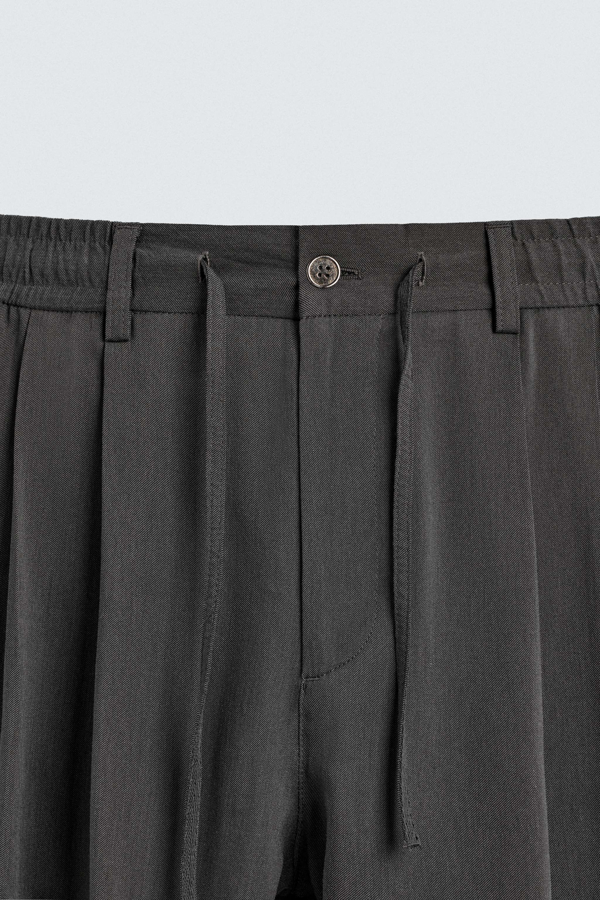 FLOWY PLEATED PANTS